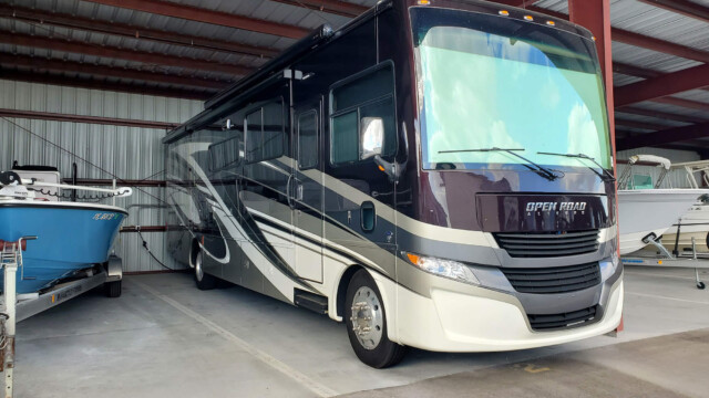 Large RV stored under covered storage area